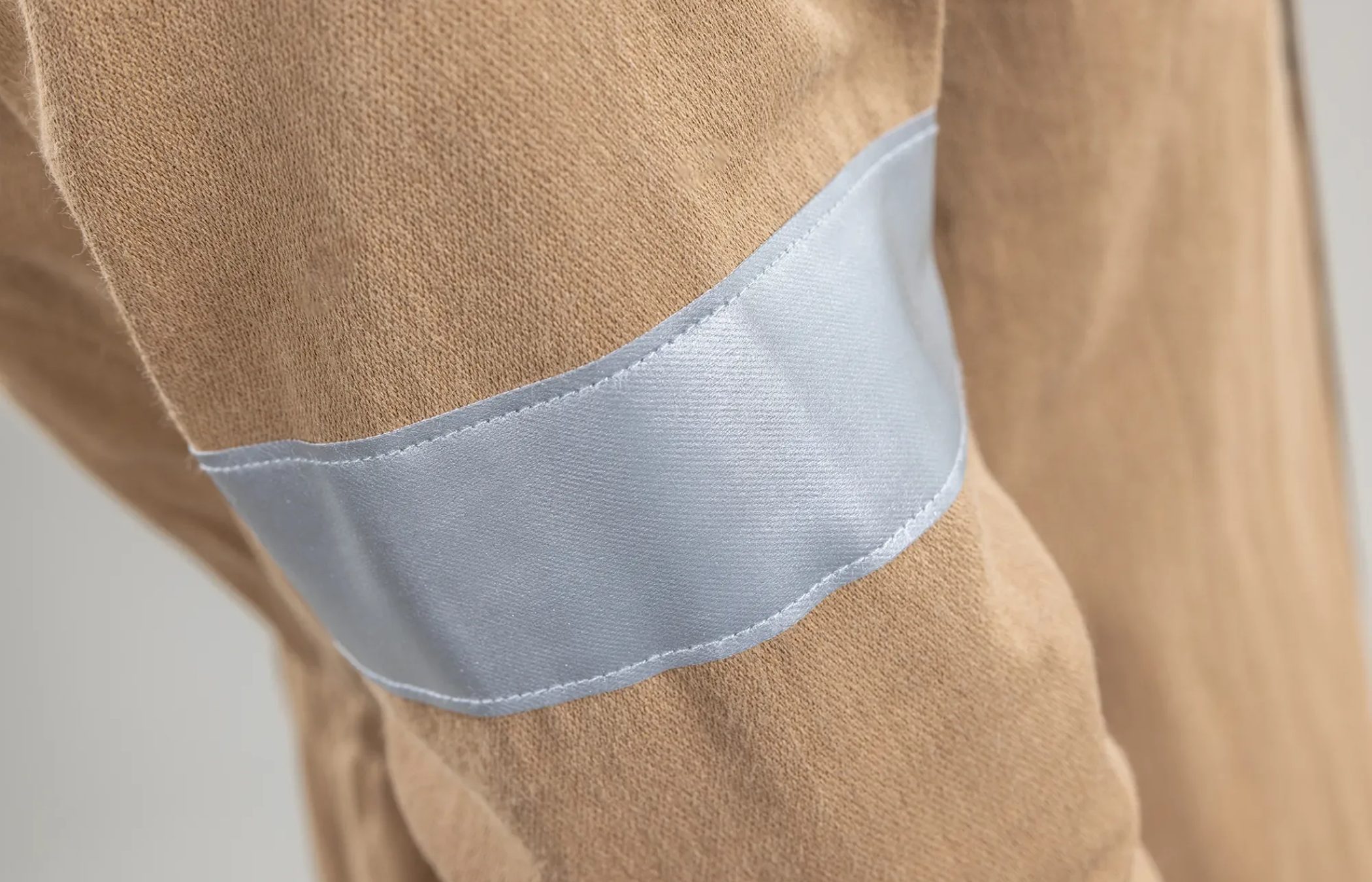 Sewn 3M™ Scotchlite™ Silver Reflective Trim on Outer Shell Fabric